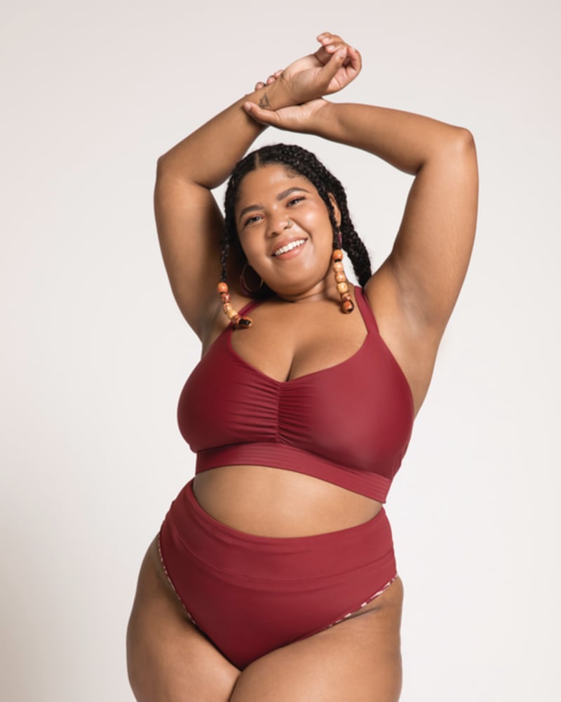 Front of a model wearing a size 34C, 34D Sunny Bikini Top in Ruby by Wild Isles. | dia_product_style_image_id:251722